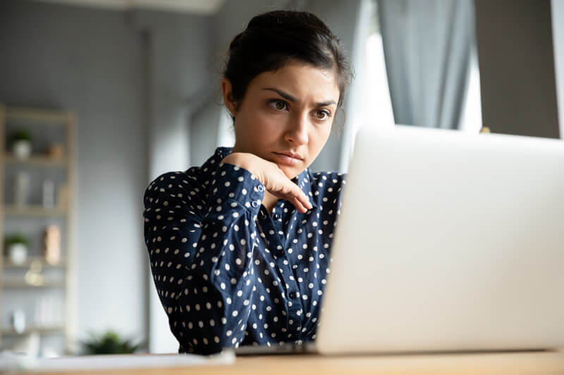A young woman explores refinancing offers.