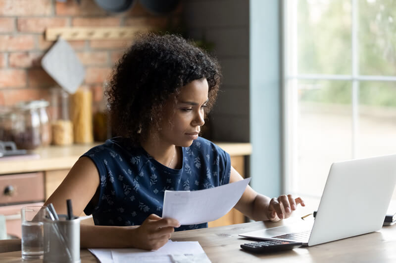 A woman considering an emergency fund.