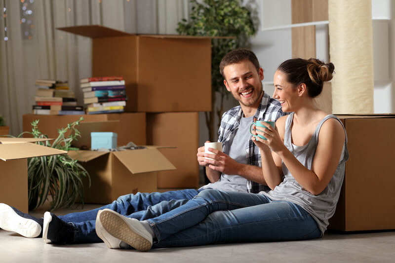 A young couple moves into their new home