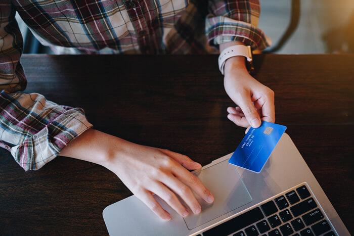 A person making a purchase with a credit card